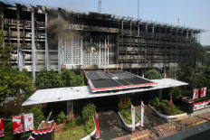The remains of the main building in the Attorney General&rsquo;s Office compound in South Jakarta continues to smolder on Aug. 25 after it was gutted by a fire the night before. The Jakarta Police have questioned 105 witnesses to determine the cause of the fire. JP/Wendra Ajistyatama