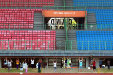 COVID-19 patients undergoing isolation at the Patriot Candrabhaga Stadium in Bekasi, West Java, participate in morning exercises on October. 2. 2020. Physical exercise is deemed important to increase patients&rsquo; immunity while undergoing isolation. JP/Dhoni Setiawan