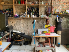 Fredi Lugina Priadi, 39, a cats cosplay costume maker, prepares a costume in Bogor, on the outskirts of Jakarta, Indonesia, November 26, 2020. Reuters/Yuddy Cahya Budiman