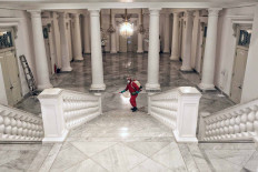 A Jakarta Fire and Rescue Agency officer disinfects City Hall on Dec. 1. The disinfection was carried out after Governor Anies Baswedan and Deputy Governor Ahmad Riza Patria had tested positive for COVID-19. JP/Seto Wardhana