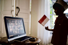 Virtual celebration: Five-year-old Rashan participates in an online commemoration of Indonesia&rsquo;s Independence Day held by the Al Azhar Kindergarten in Jakarta on Aug.17. The commemoration was held online as school buildings across the country were shut in response to the coronavirus. JP/Seto Wardhana