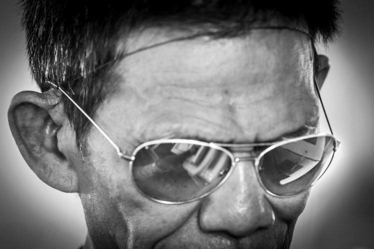 A blind voter gets prepared to vote at polling station TPS 39 Kampung Tuna Netra on April 17, 2019, in Palembang, South Sumatra.