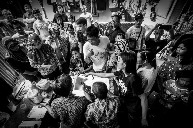  Residents complain to elections officials because they did not get ballot papers on April 17, 2019, on Jl. Veteran in Palembang, South Sumatra. Polling stations (TPS) ran out of ballot papers, forcing the South Sumatra General Elections Commission (KPUD) to hold pemilu susulan (sequel elections) on April 27, 2019.